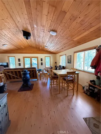 a bathroom with a granite countertop toilet sink and mirror