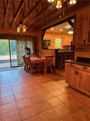 a view of a patio with dining table and chairs
