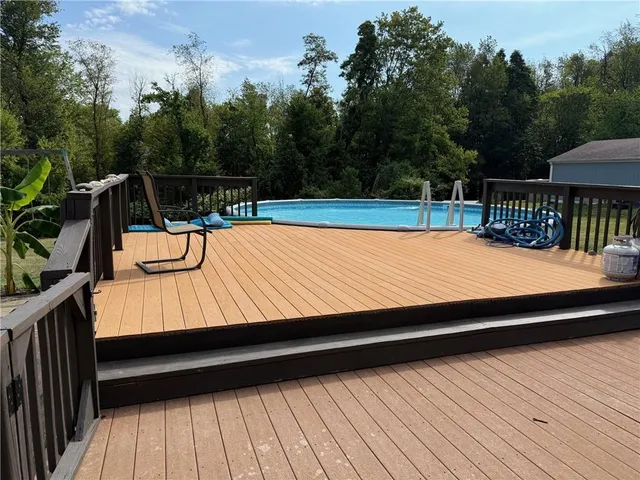 a view of a swimming pool with a patio