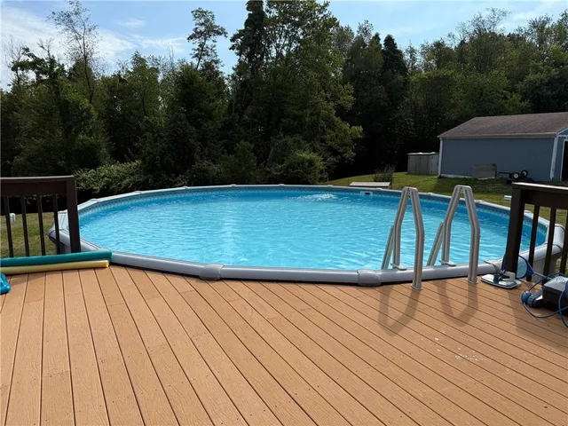 a view of a house with wooden deck