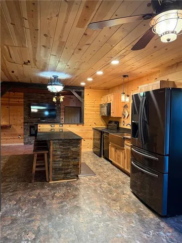 a large room with lots of counter space and windows