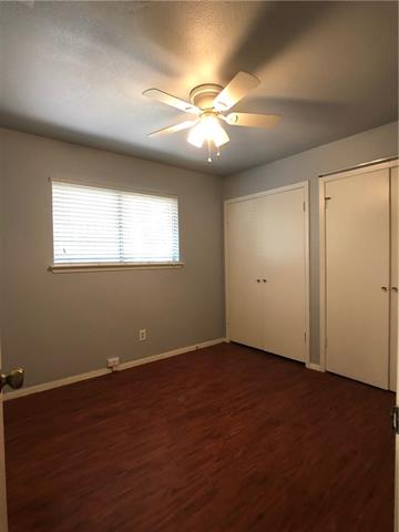 4008 Cima Serena Drive, Unit B Austin, TX 78759 - Photo 12 of 16 an empty room with windows and fan