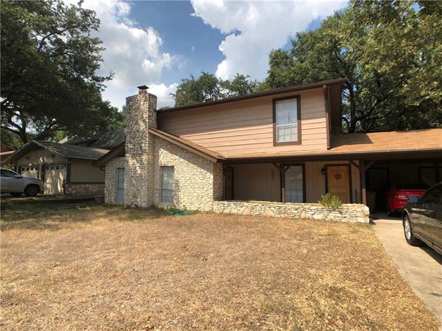 4008 Cima Serena Drive, Unit B Austin, TX 78759 - Photo 3 of 16 a front view of a house with a yard covered with snow
