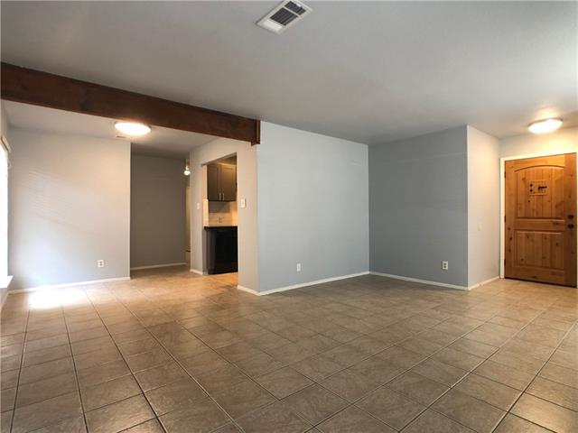 4008 Cima Serena Drive, Unit B Austin, TX 78759 - Photo 5 of 16 an empty room with windows and fireplace