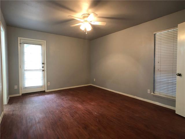 4008 Cima Serena Drive, Unit B Austin, TX 78759 - Photo 9 of 16 an empty room with wooden floor and windows