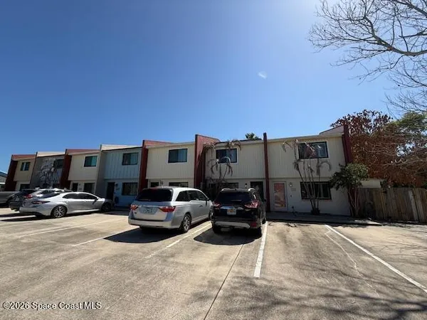 a view of parking space with parked cars