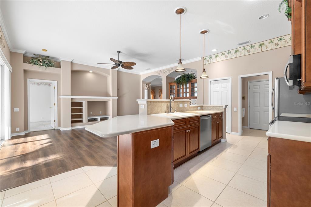 2125 Gold Dust Court New Port Richey, FL 34655 - Photo 20 of 54 a large kitchen with stainless steel appliances granite countertop a sink and cabinets