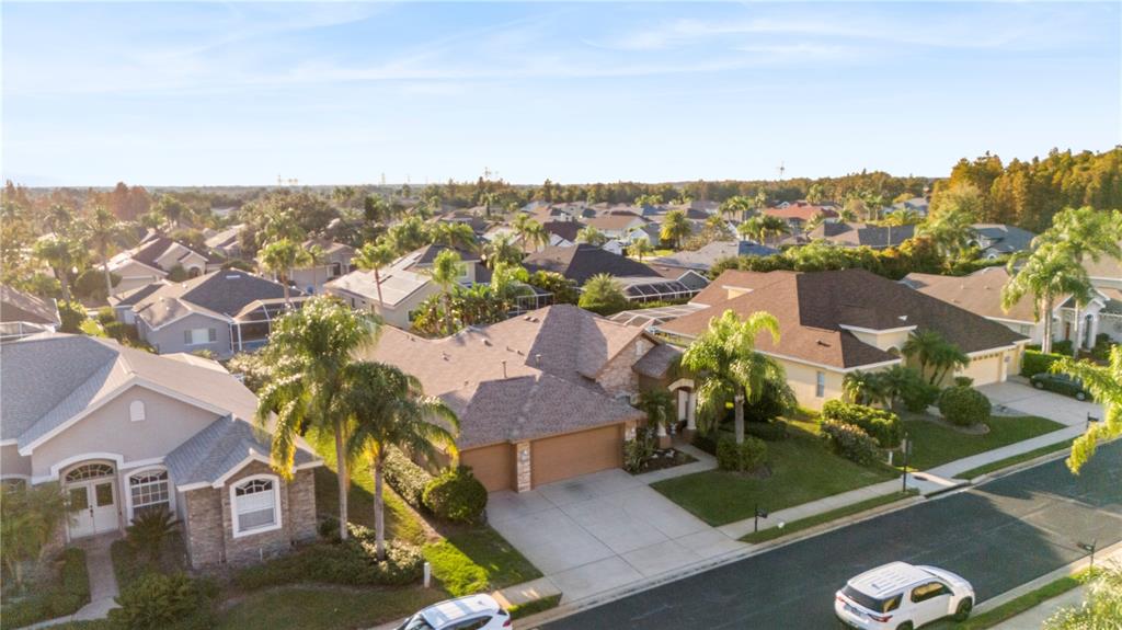 2125 Gold Dust Court New Port Richey, FL 34655 - Photo 2 of 54 an aerial view of residential houses with outdoor space and trees