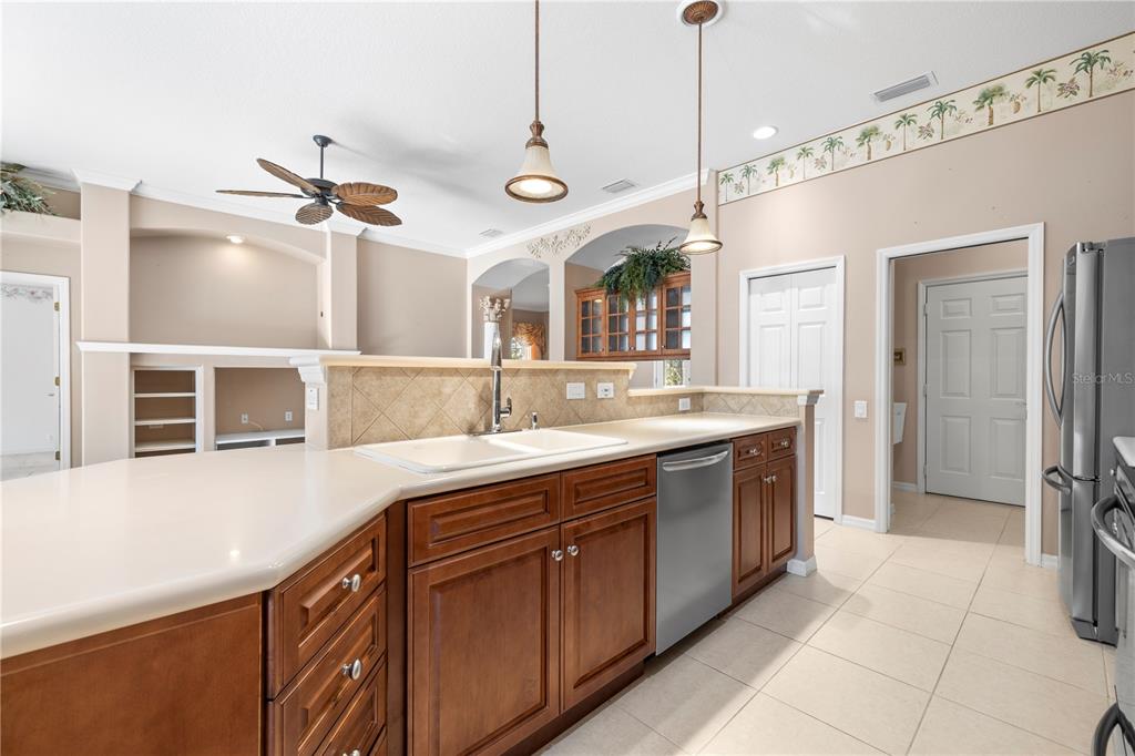2125 Gold Dust Court New Port Richey, FL 34655 - Photo 21 of 54 a kitchen with a sink and refrigerator