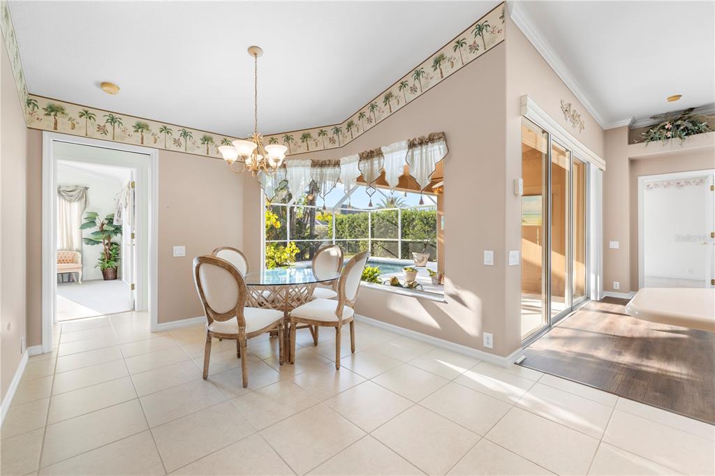 2125 Gold Dust Court New Port Richey, FL 34655 - Photo 24 of 54 a dining room with furniture and large windows