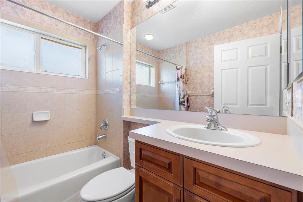 2125 Gold Dust Court New Port Richey, FL 34655 - Photo 29 of 54 a bathroom with a sink toilet tub and shower