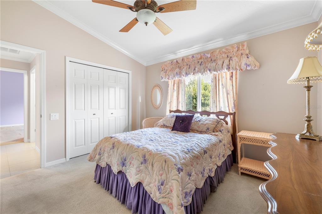 2125 Gold Dust Court New Port Richey, FL 34655 - Photo 31 of 54 a bedroom with a bed and a chandelier