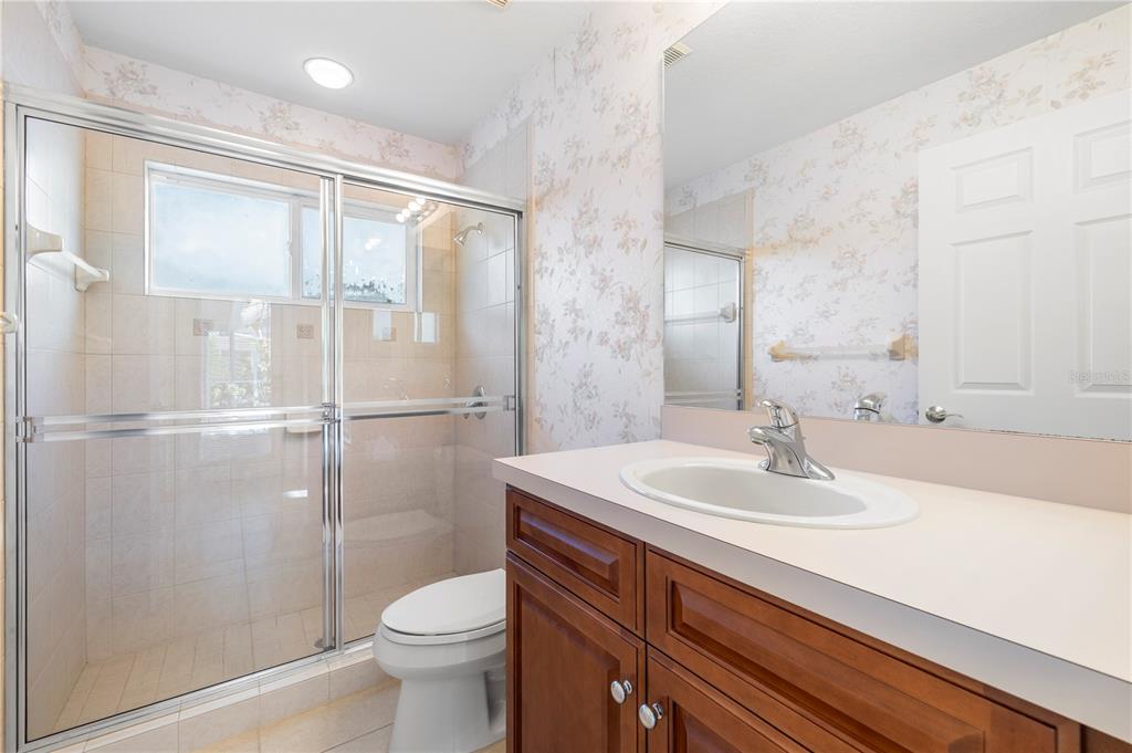 2125 Gold Dust Court New Port Richey, FL 34655 - Photo 32 of 54 a bathroom with a sink toilet and shower