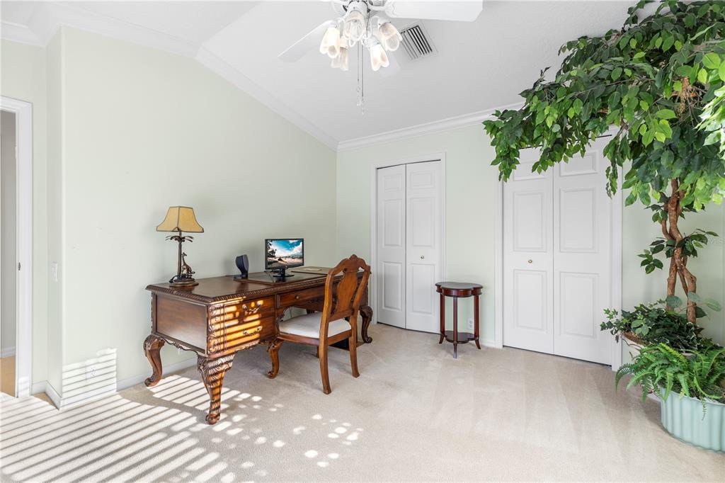 2125 Gold Dust Court New Port Richey, FL 34655 - Photo 33 of 54 a living room with furniture and flowers