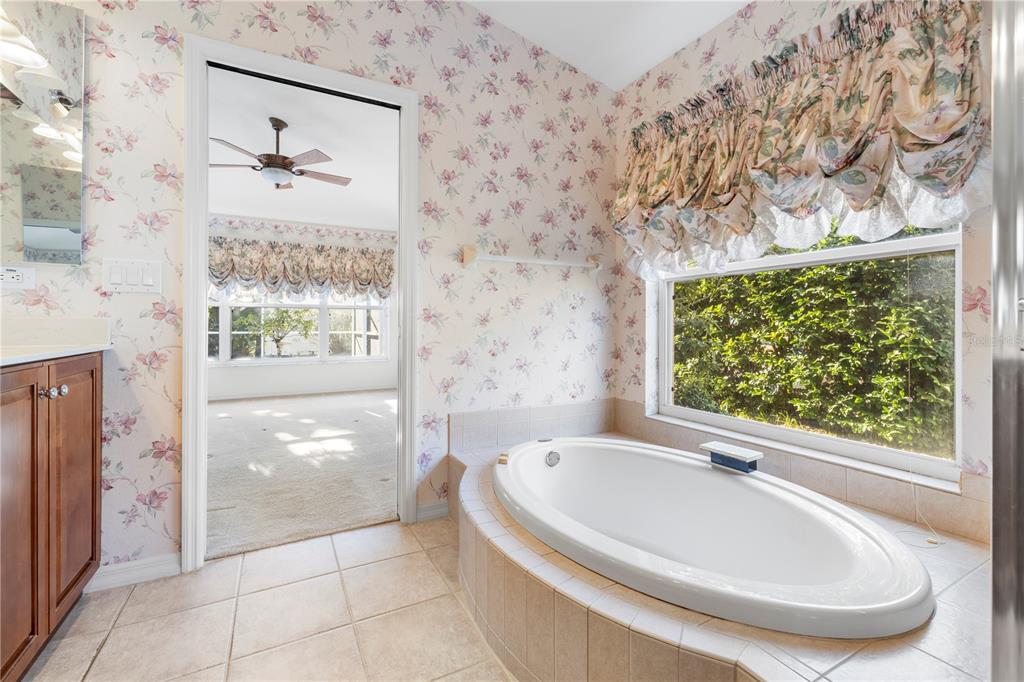 2125 Gold Dust Court New Port Richey, FL 34655 - Photo 39 of 54 a bathroom with a bathtub and shower