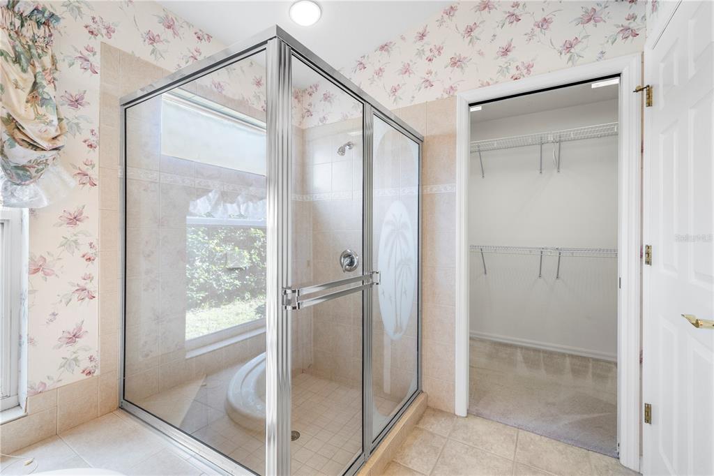 2125 Gold Dust Court New Port Richey, FL 34655 - Photo 41 of 54 a bathroom with a glass shower door