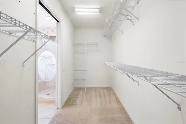 a view of a backyard with table and chairs potted plants