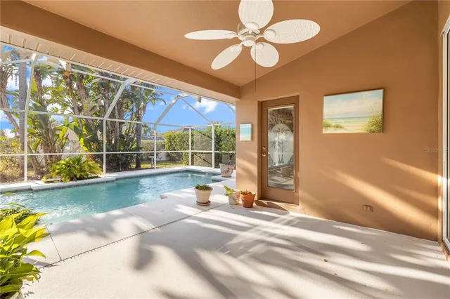 a view of swimming pool with outdoor seating