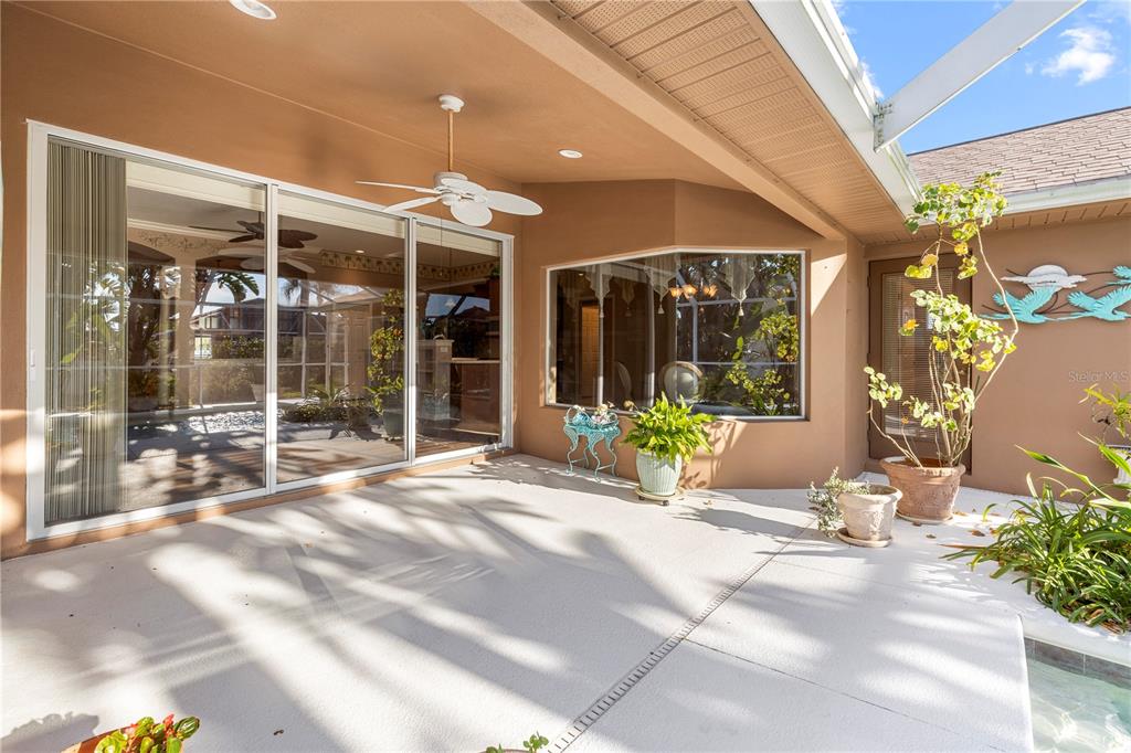 2125 Gold Dust Court New Port Richey, FL 34655 - Photo 50 of 54 a view of a building with large windows and plants