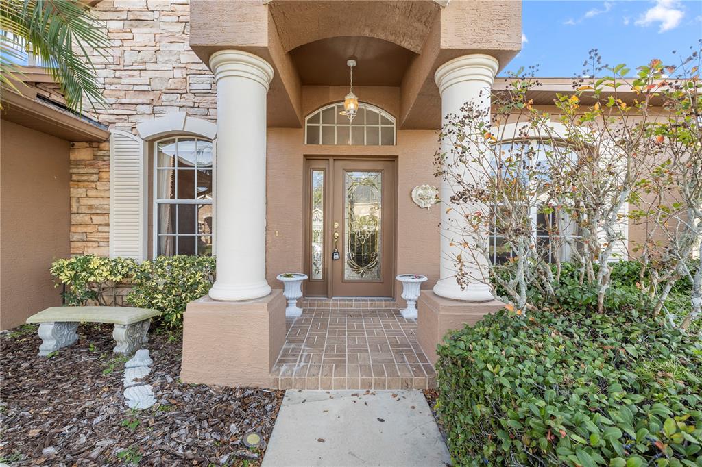 2125 Gold Dust Court New Port Richey, FL 34655 - Photo 51 of 54 a front view of a house with a garden