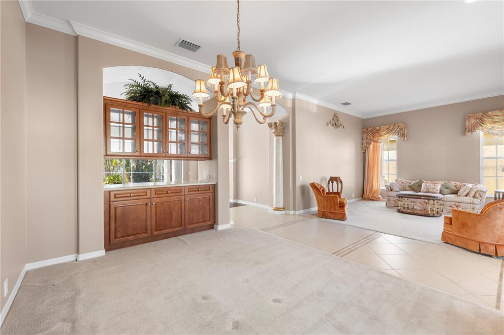 2125 Gold Dust Court New Port Richey, FL 34655 - Photo 10 of 54 a living room with furniture and a chandelier