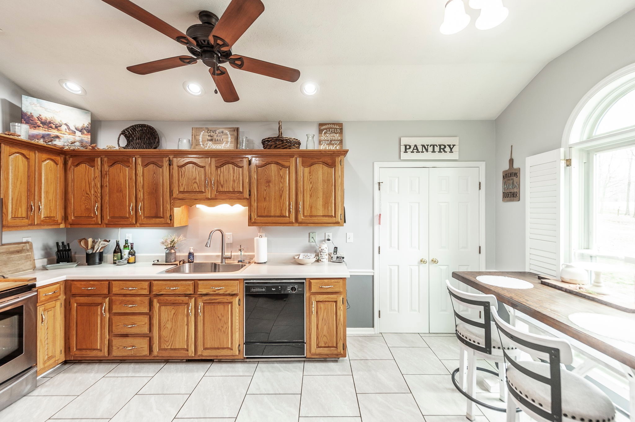 1251 Smith Thompson Road Bethpage, TN 37022 - Photo 17 of 71 a kitchen with a sink counter top space cabinets and stainless steel appliances