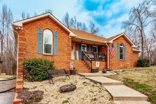 1251 Smith Thompson Road Bethpage, TN 37022 - Photo 2 of 71 a front view of a house with a yard