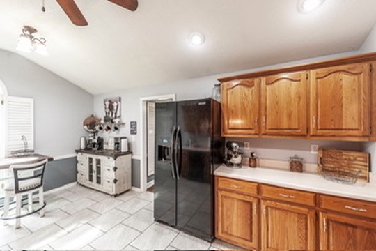 1251 Smith Thompson Road Bethpage, TN 37022 - Photo 22 of 71 a kitchen with stainless steel appliances a refrigerator sink and cabinets