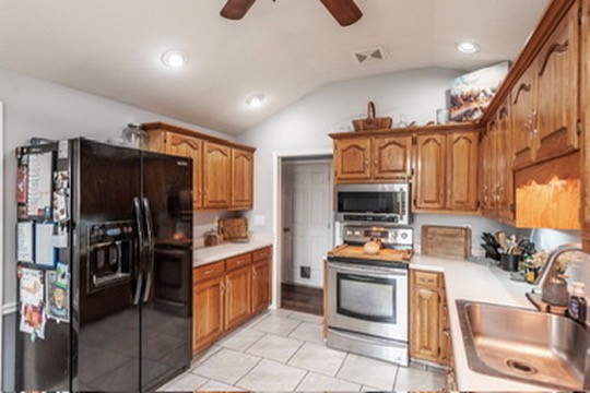 1251 Smith Thompson Road Bethpage, TN 37022 - Photo 23 of 71 a kitchen with stainless steel appliances granite countertop a stove refrigerator and a sink