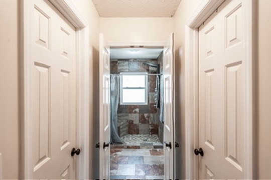 1251 Smith Thompson Road Bethpage, TN 37022 - Photo 31 of 71 a bathroom with a glass shower door and a mirror