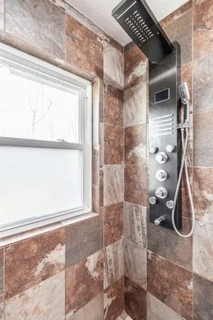 a bathroom with a sink a toilet and shower curtain
