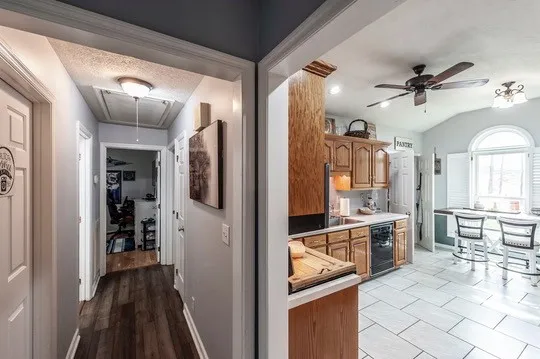 a living room with furniture a air conditioner vent and a window