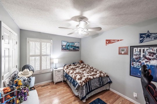 1251 Smith Thompson Road Bethpage, TN 37022 - Photo 40 of 71 a bedroom with a bed and a chandelier