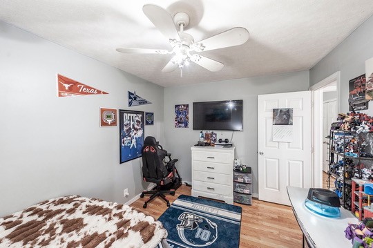 1251 Smith Thompson Road Bethpage, TN 37022 - Photo 41 of 71 a bedroom with furniture and flat screen tv