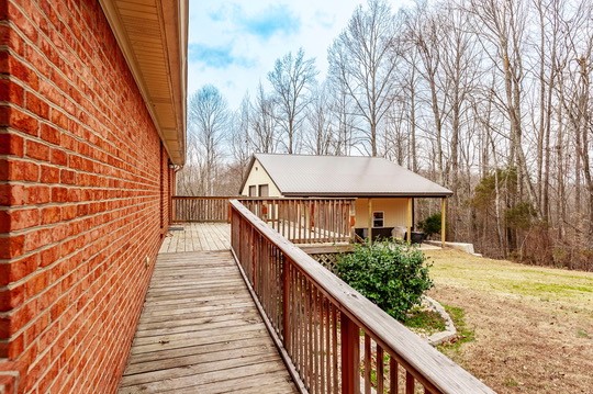 1251 Smith Thompson Road Bethpage, TN 37022 - Photo 57 of 71 a balcony with wooden floor and trees