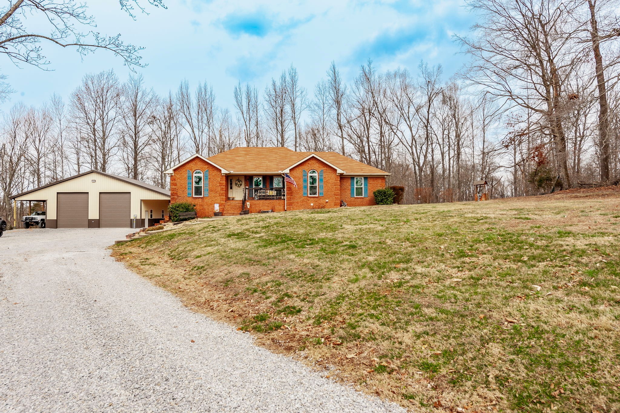 1251 Smith Thompson Road Bethpage, TN 37022 - Photo 6 of 71 a house with trees in front of it