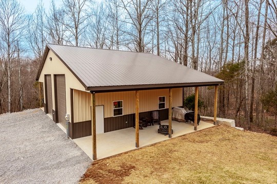 1251 Smith Thompson Road Bethpage, TN 37022 - Photo 61 of 71 a view of a house with backyard porch and sitting area