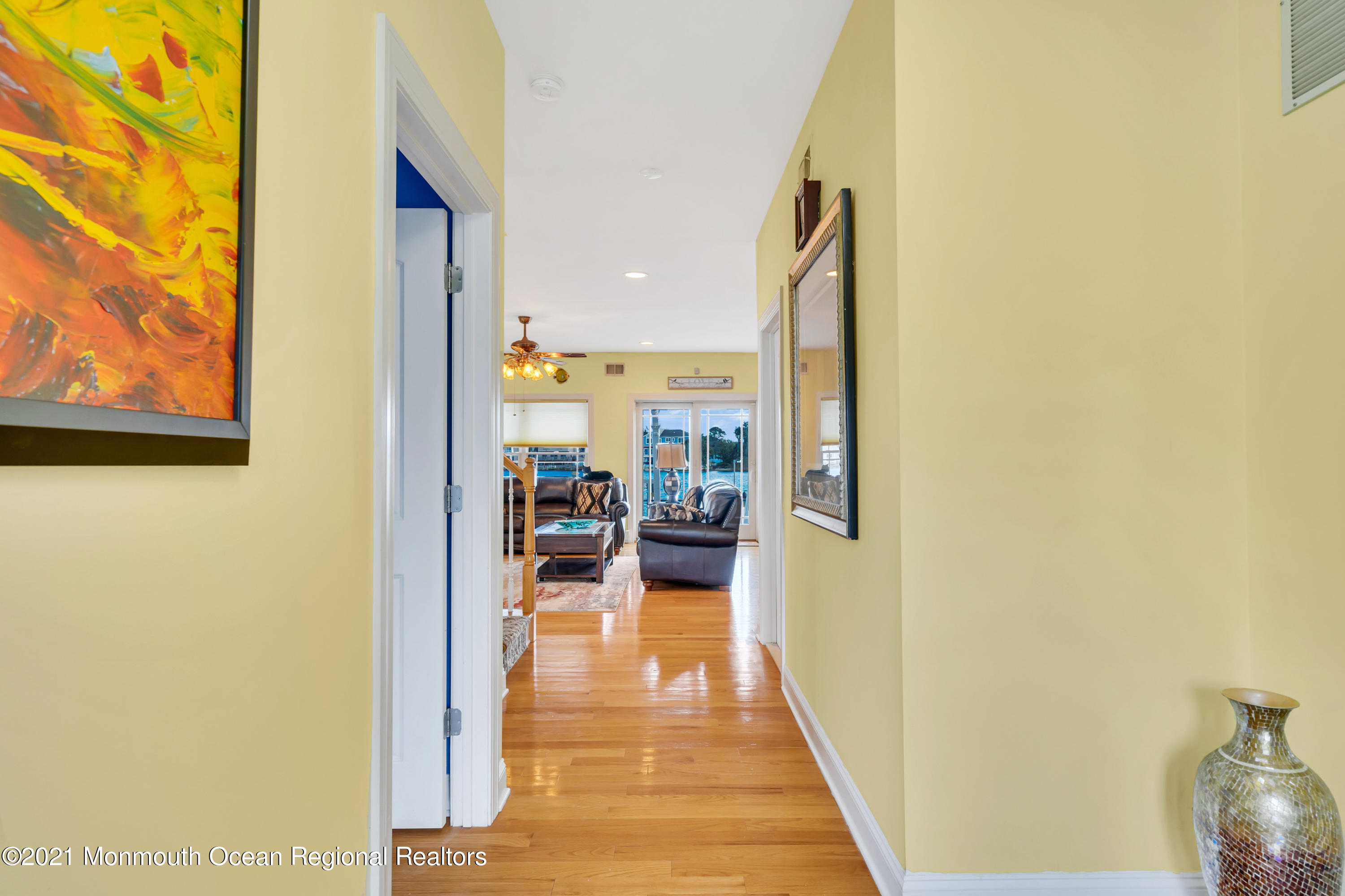 55 Bay Way Brick, NJ 08723 - Photo 2 of 55 a hallway with a view of living room with a wooden floor