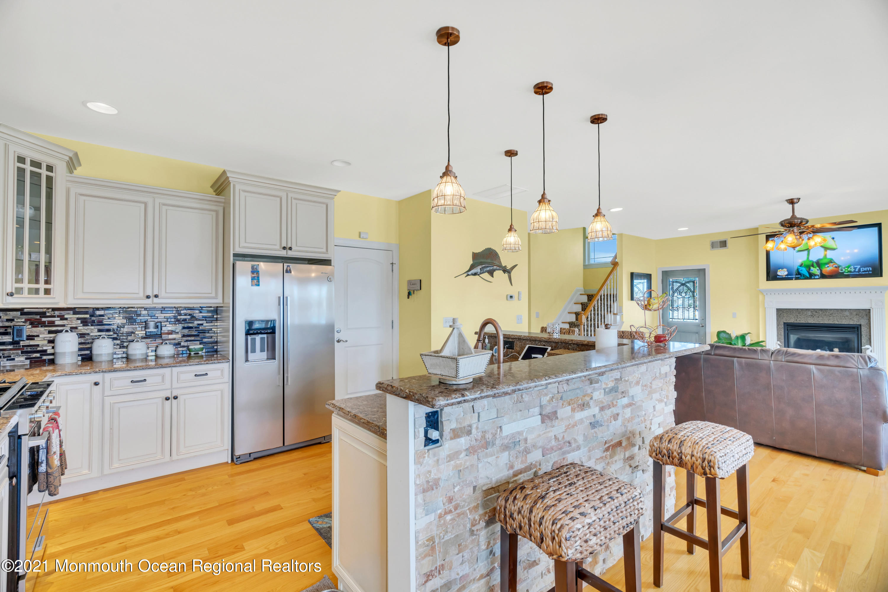 55 Bay Way Brick, NJ 08723 - Photo 21 of 55 a kitchen with a table chairs and refrigerator