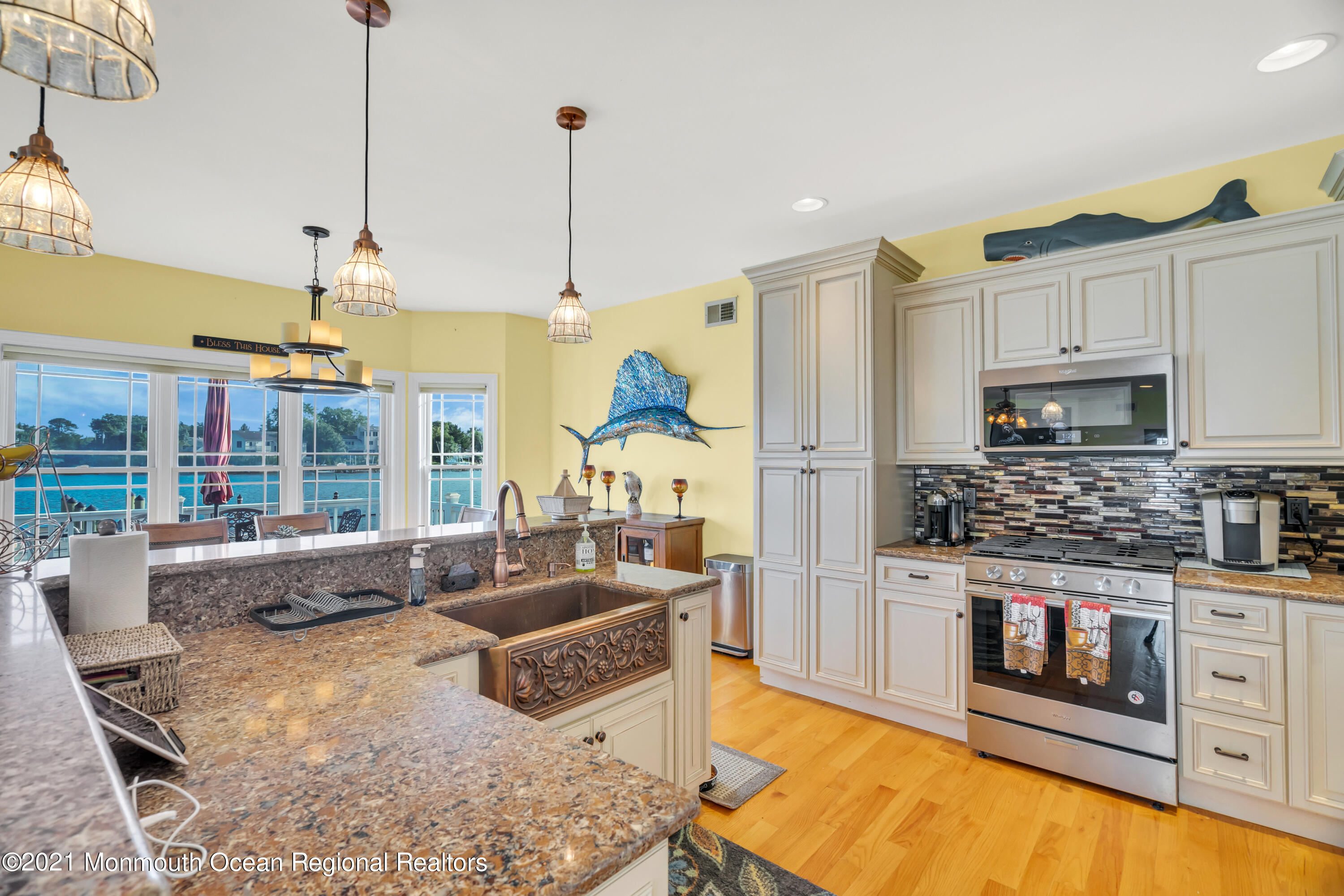 55 Bay Way Brick, NJ 08723 - Photo 22 of 55 a kitchen with stainless steel appliances granite countertop a stove a sink and a refrigerator