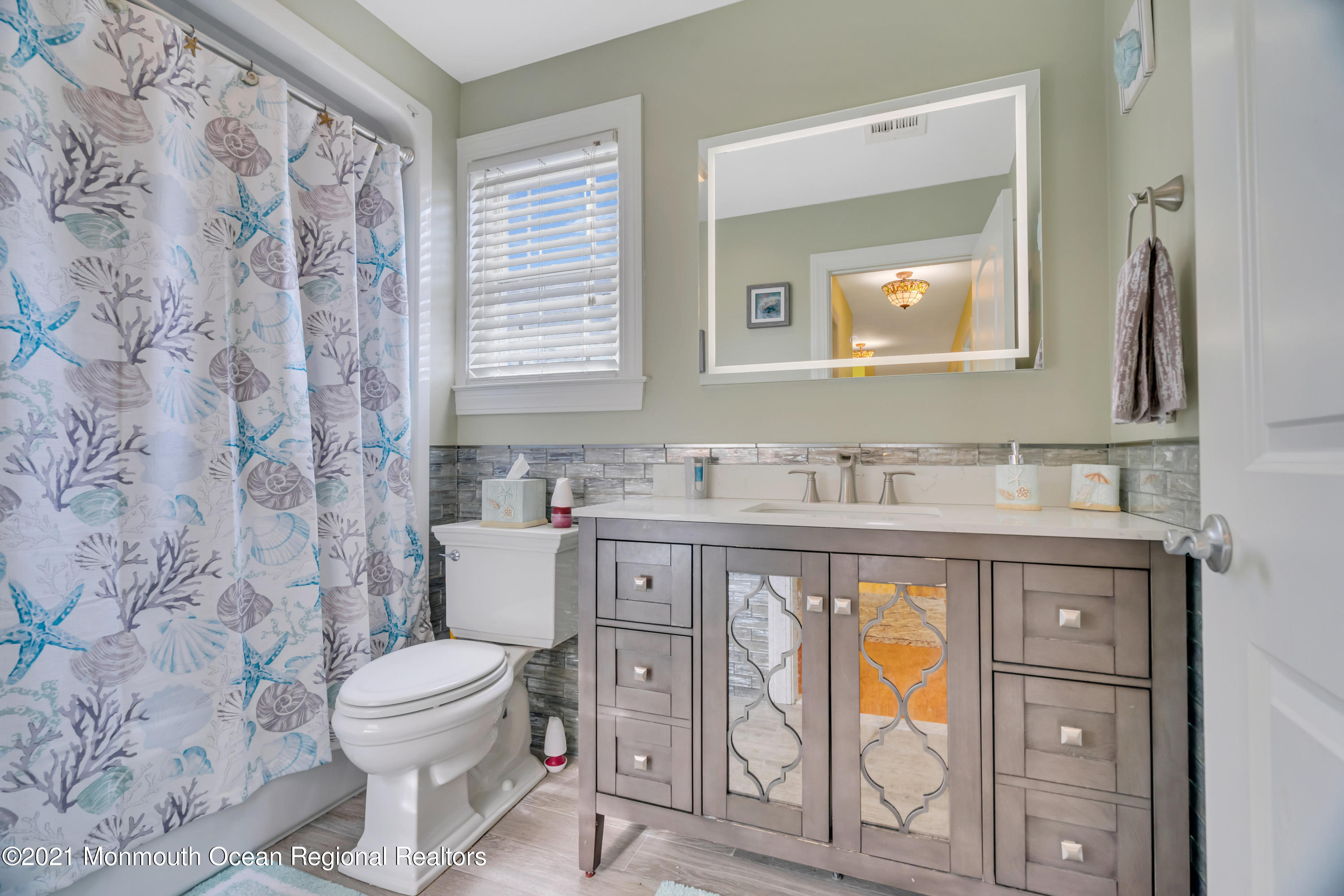 55 Bay Way Brick, NJ 08723 - Photo 26 of 55 a bathroom with a granite countertop toilet sink and mirror