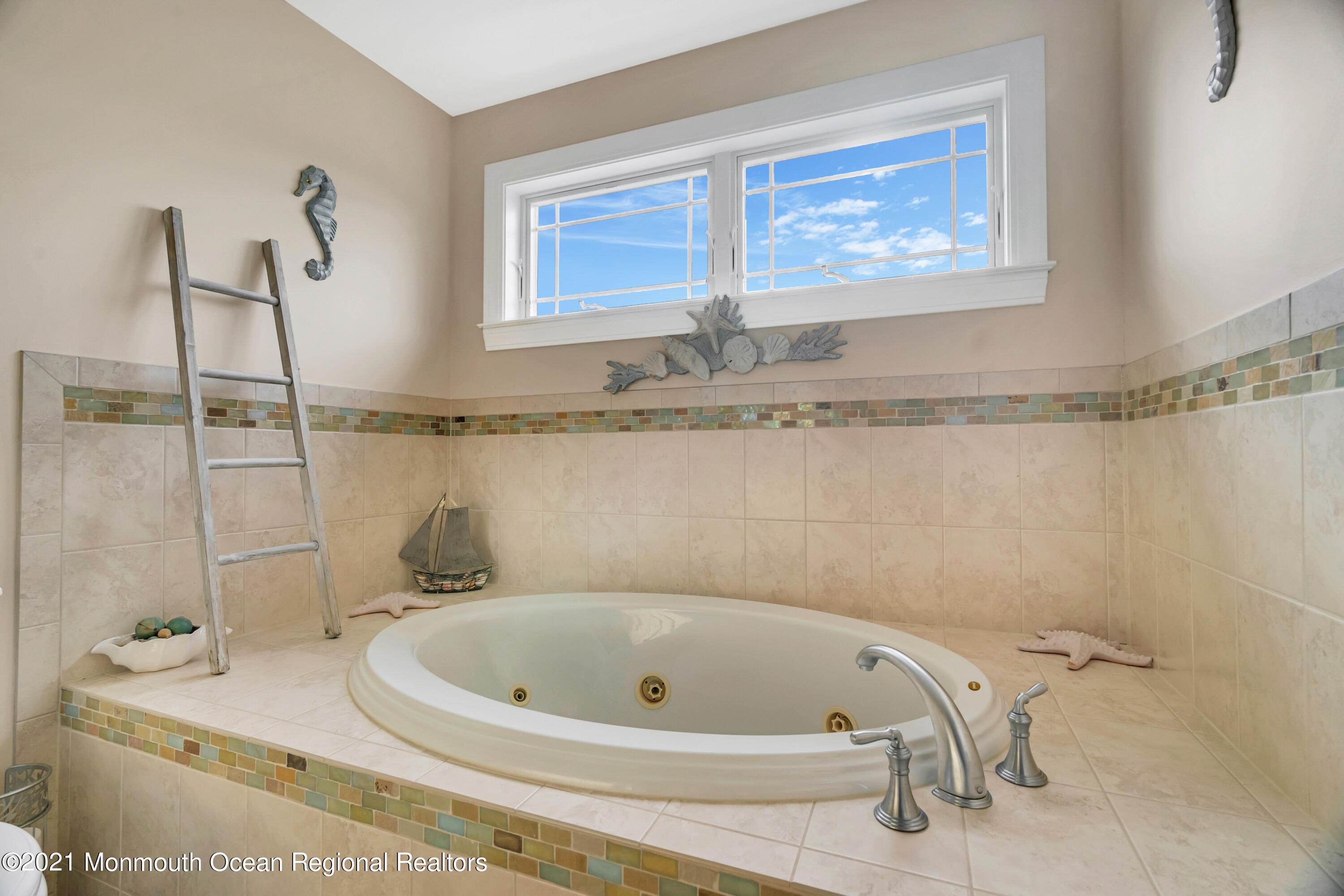 55 Bay Way Brick, NJ 08723 - Photo 30 of 55 a bathroom with a tub and a shower
