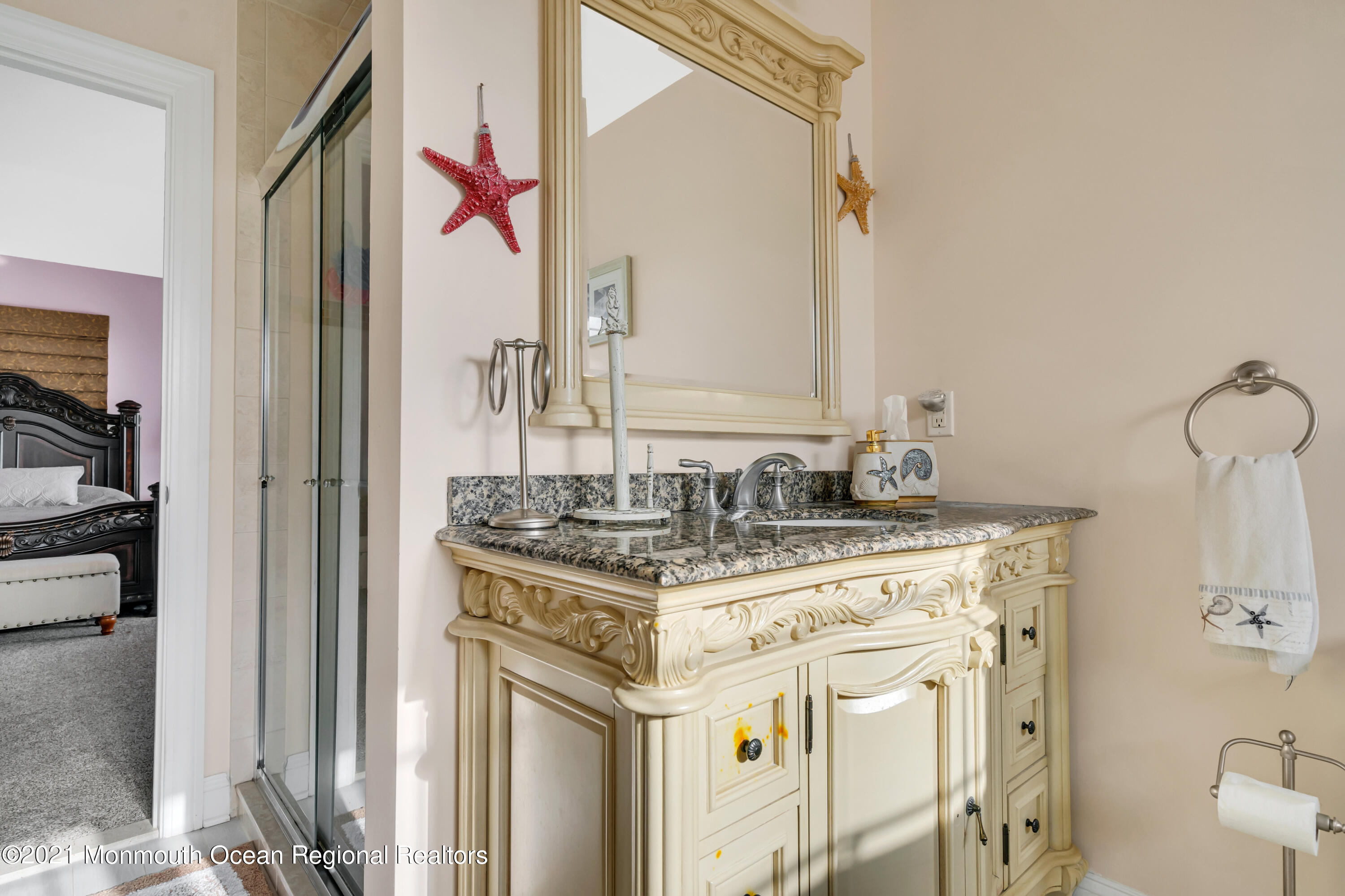 55 Bay Way Brick, NJ 08723 - Photo 31 of 55 a bathroom with a sink and a mirror