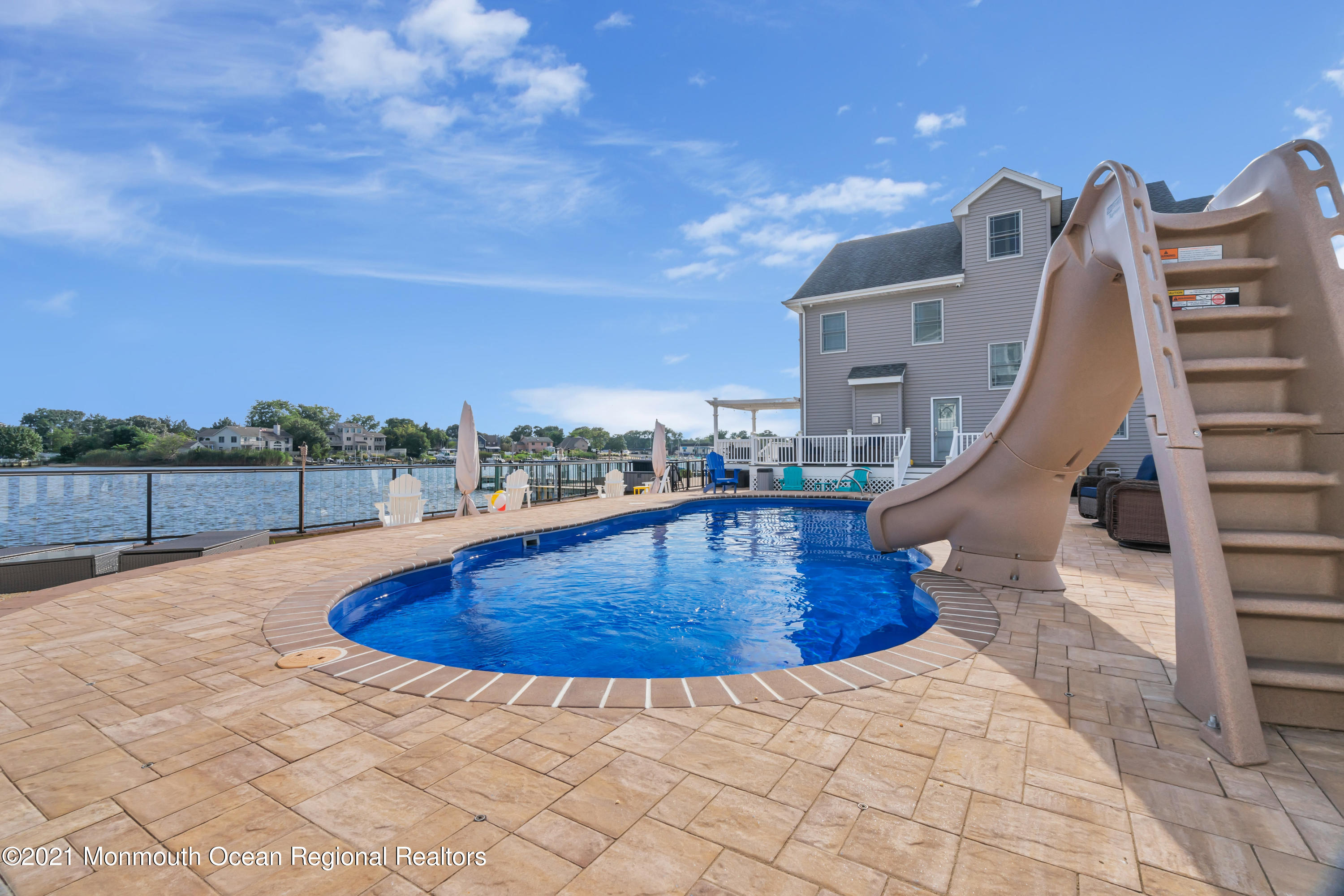 55 Bay Way Brick, NJ 08723 - Photo 37 of 55 a view of a swimming pool with a terrace