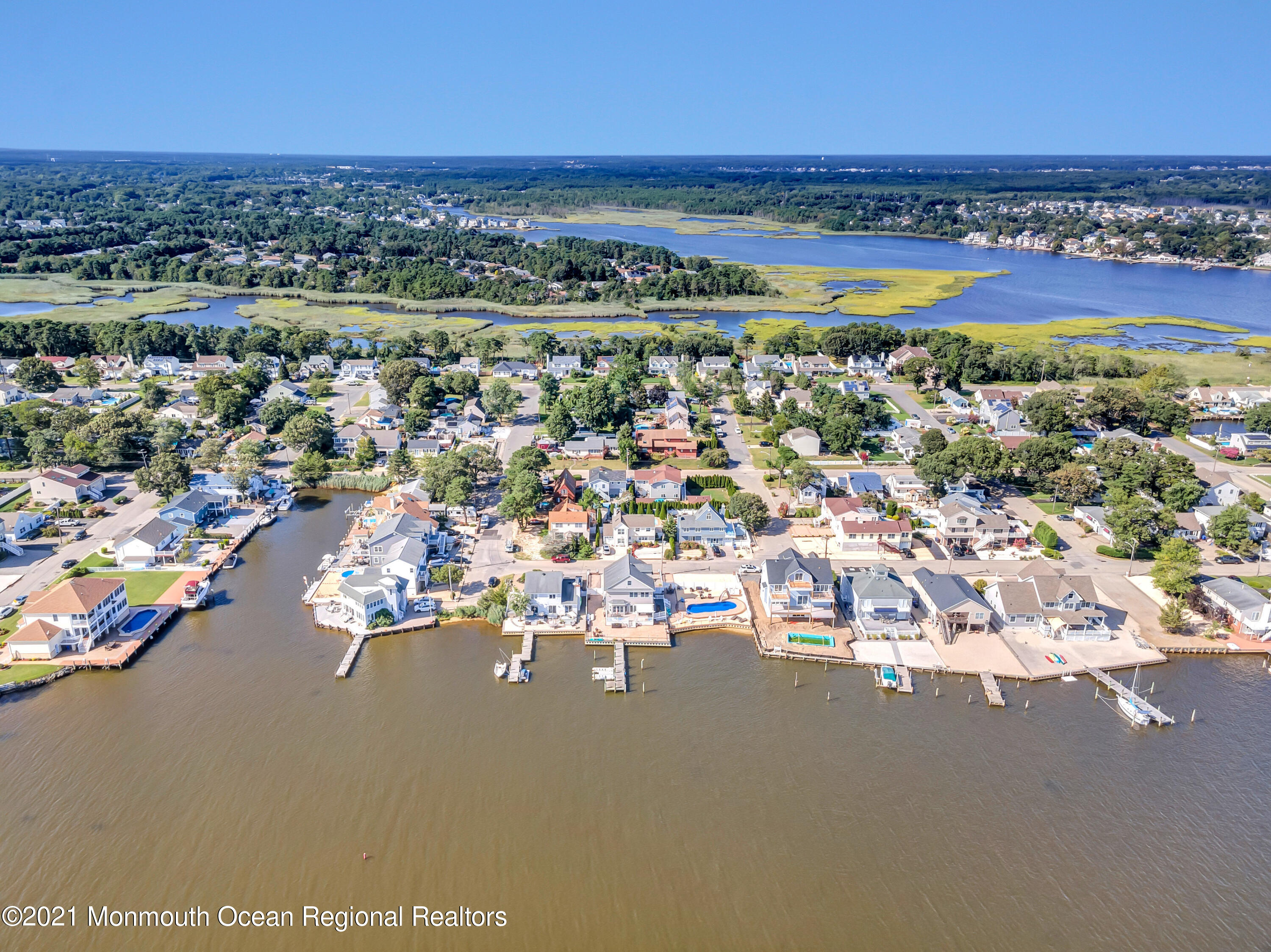 55 Bay Way Brick, NJ 08723 - Photo 45 of 55 an aerial view of a city with lots of residential buildings ocean and mountain view in back