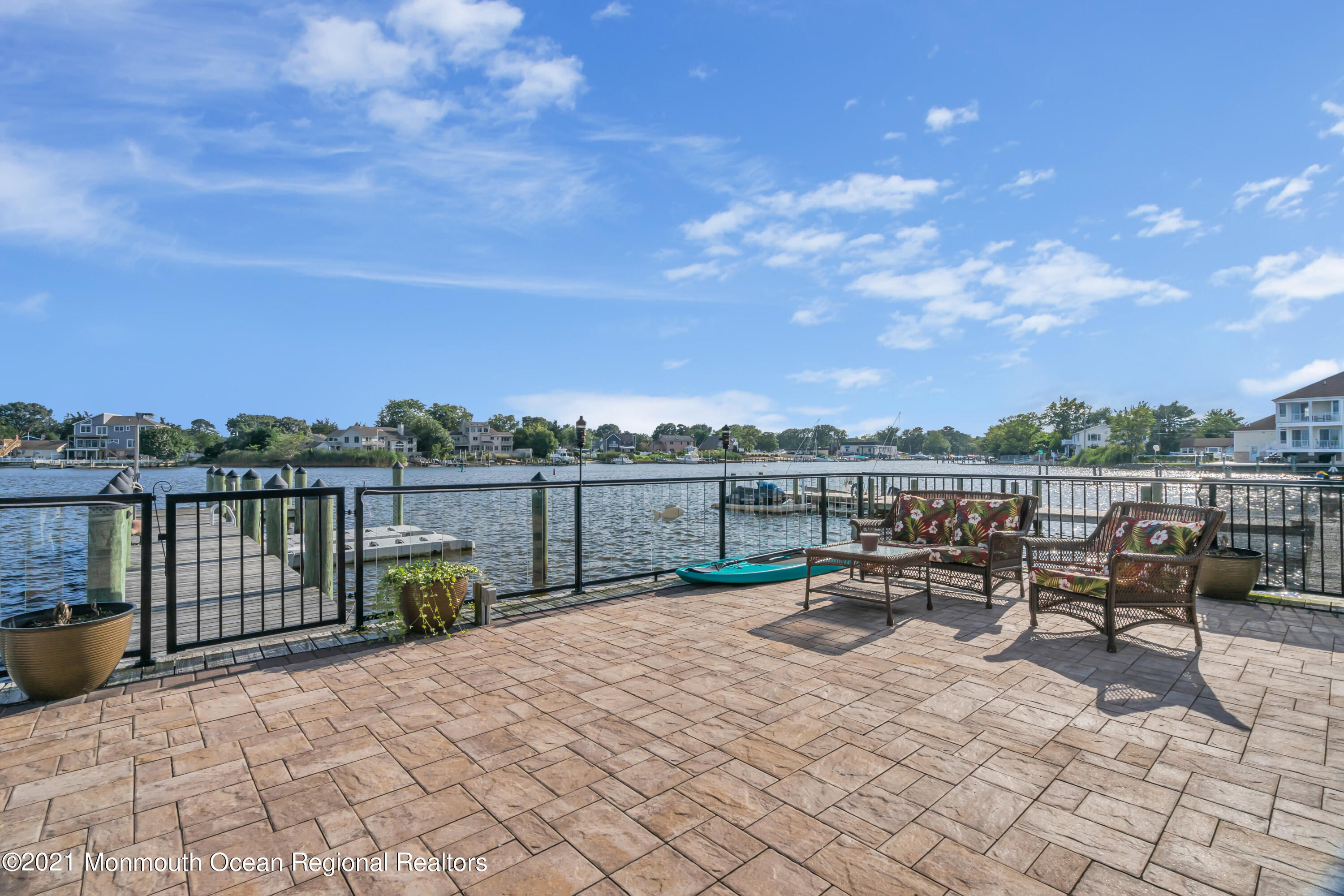55 Bay Way Brick, NJ 08723 - Photo 51 of 55 a roof deck with table and chairs