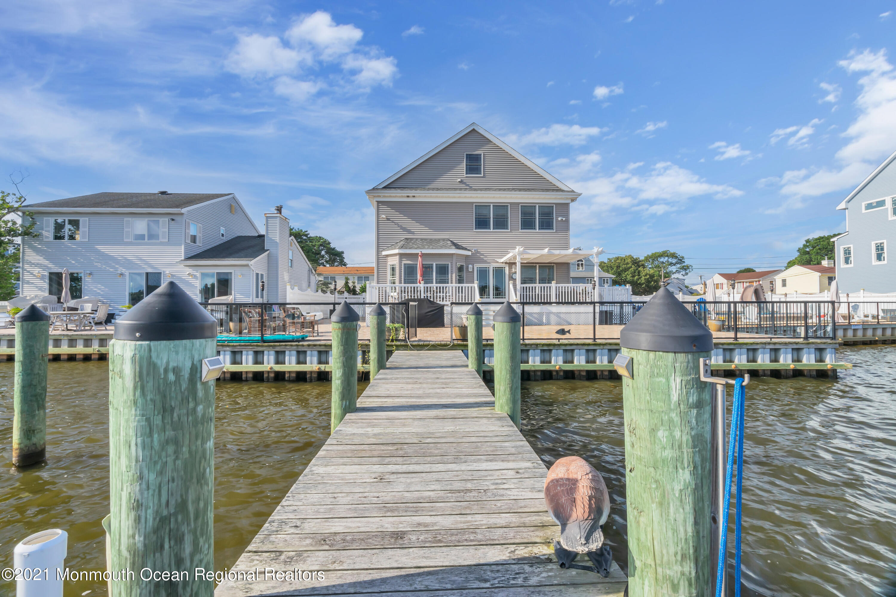 55 Bay Way Brick, NJ 08723 - Photo 54 of 55 a front view of a house with a lake view