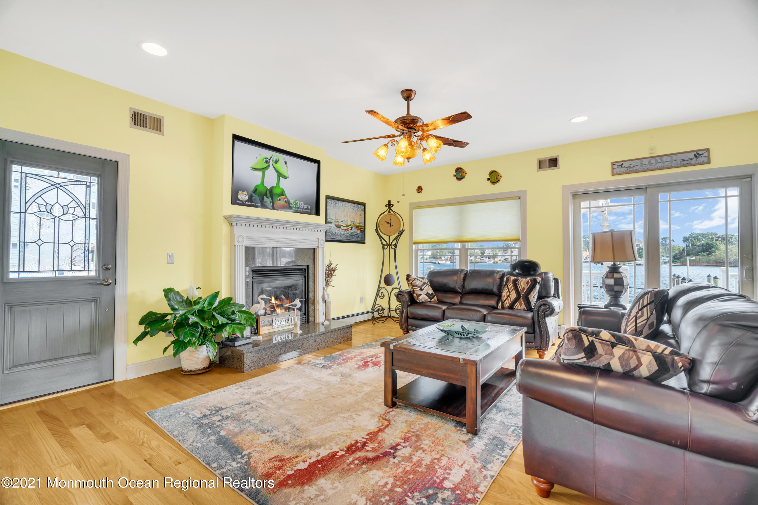 55 Bay Way Brick, NJ 08723 - Photo 6 of 55 a living room with furniture fireplace and a large window