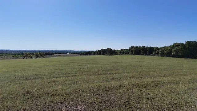 a view of a field with an outdoor space
