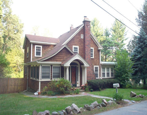 35 Loring Road Weston, MA 02493 - Photo 1 of 1 a front view of a house with a yard